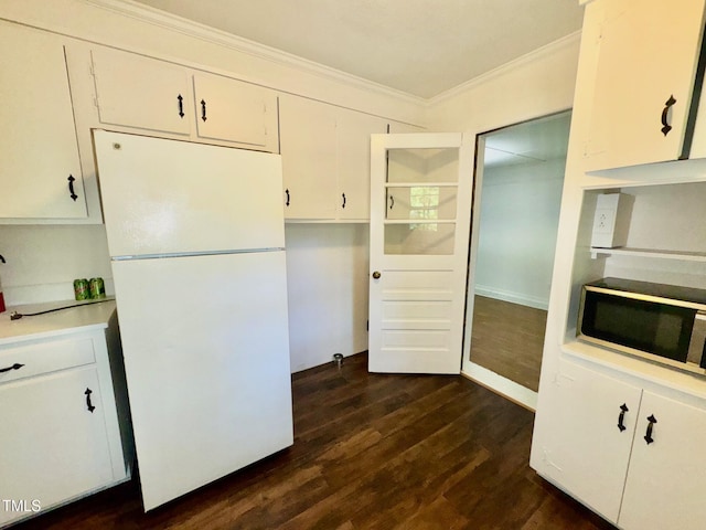 1713 S Garnett St, Henderson, NC 27536 - kitchen featuring freestanding refrigerator, ornamental molding, white cabinets, dark wood finished floors, and light countertops