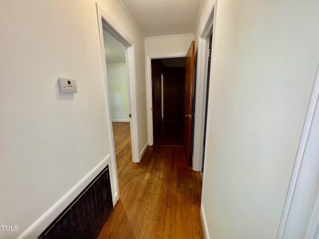 1713 S Garnett St, Henderson, NC 27536 - hallway featuring wood finished floors and ornamental molding