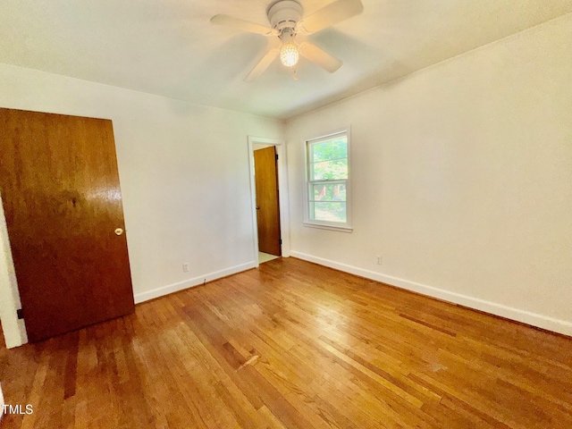 1713 S Garnett St, Henderson, NC 27536 - unfurnished bedroom featuring wood finished floors, baseboards, and a ceiling fan