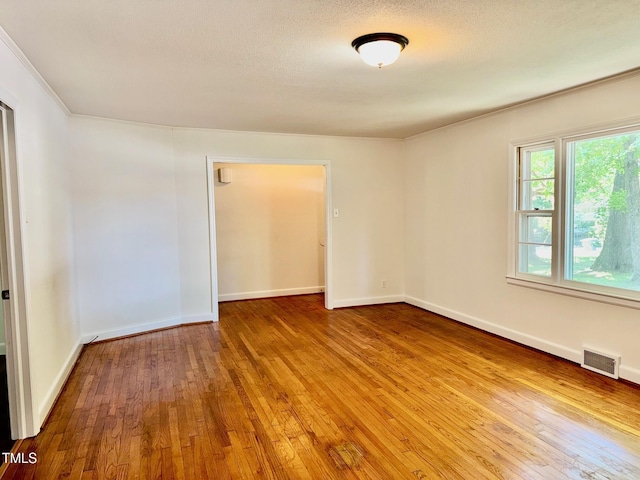 1713 S Garnett St, Henderson, NC 27536 - unfurnished room with hardwood / wood-style floors, crown molding, and baseboards