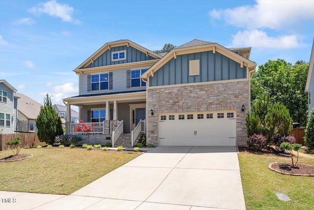 105 Blue Prince Trl, Holly Springs, NC 27540 - craftsman house featuring board and batten siding, a porch, stone siding, concrete driveway, and a garage