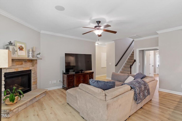 105 Blue Prince Trl, Holly Springs, NC 27540 - living room featuring ornamental molding, wood finished floors, ceiling fan, stairs, and baseboards