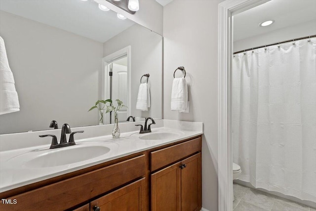 105 Blue Prince Trl, Holly Springs, NC 27540 - bathroom with toilet, double vanity, and tile patterned floors