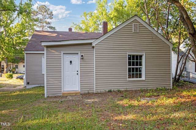 226 S Windsor Dr, Fayetteville, NC 28301 - rear view of house with a chimney and roof with shingles