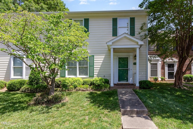 view of front of home with a front lawn