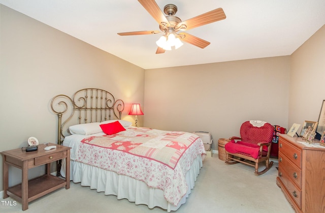 bedroom with ceiling fan and light colored carpet
