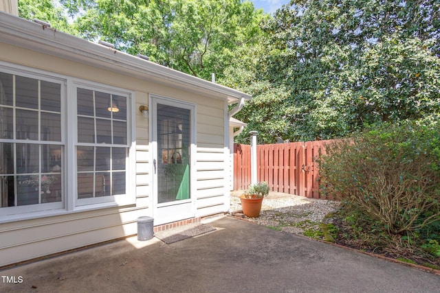 exterior space featuring a patio area and fence