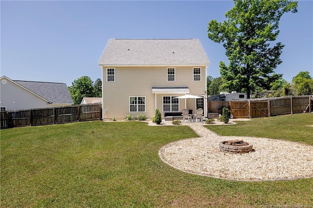back of property featuring a lawn, a fenced backyard, an outdoor fire pit, and a patio area