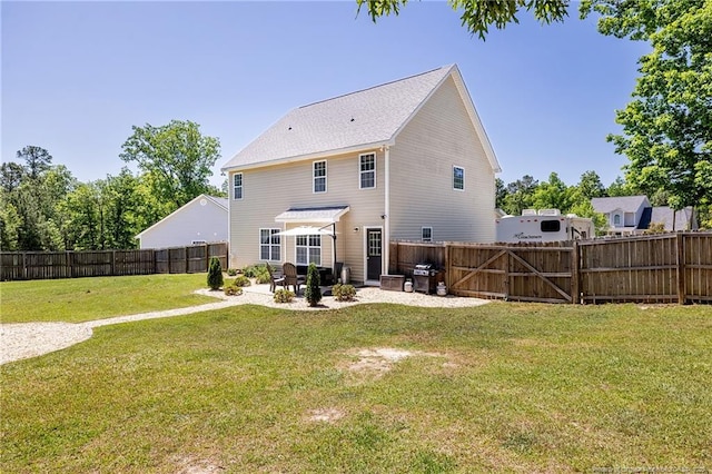 back of property with a lawn, a fenced backyard, and a patio area