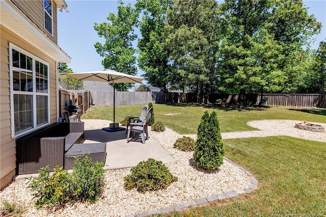 view of yard with a fenced backyard and a patio area