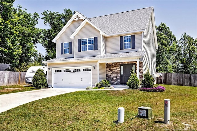 view of front of property featuring an attached garage, fence, a front yard, and concrete driveway