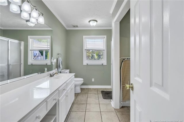 full bath with vanity, toilet, a textured ceiling, baseboards, and a stall shower