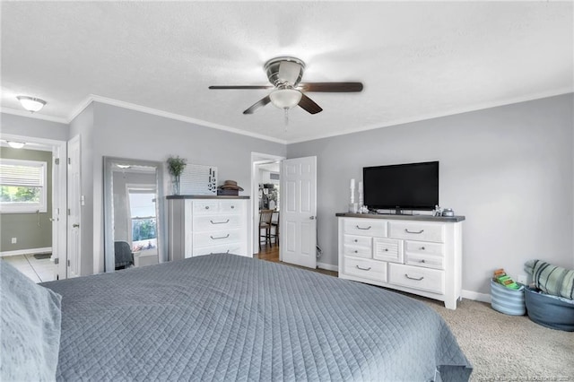 bedroom featuring crown molding, baseboards, and ceiling fan