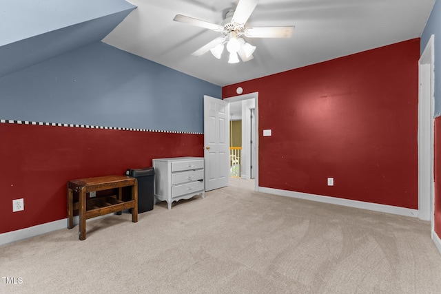 carpeted bedroom featuring baseboards, a ceiling fan, and vaulted ceiling