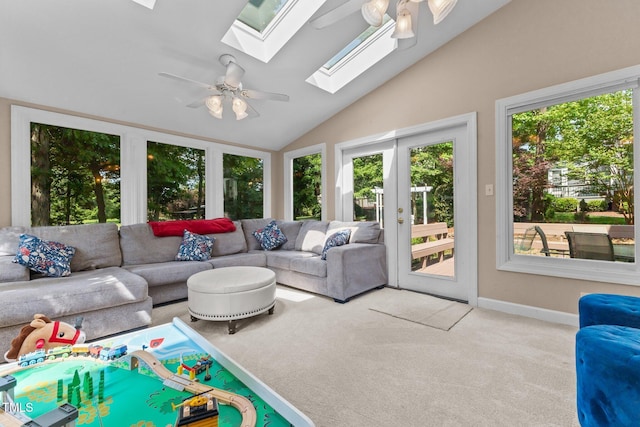 sunroom featuring a skylight and french doors