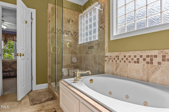 bathroom featuring plenty of natural light, a jetted tub, ensuite bathroom, and a stall shower
