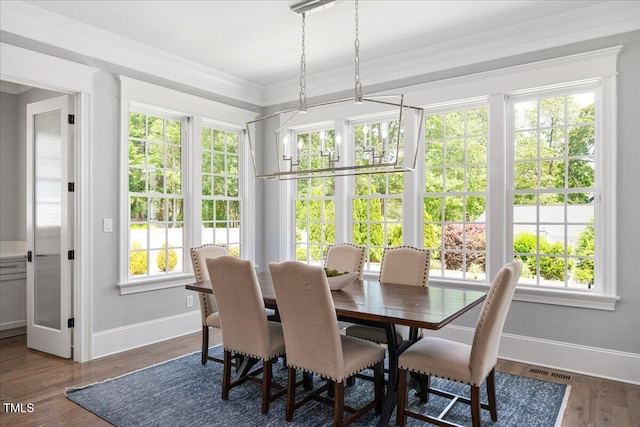 sunroom / solarium featuring french doors