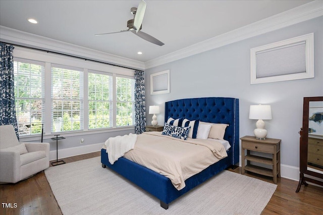bedroom featuring crown molding, baseboards, wood finished floors, recessed lighting, and a ceiling fan