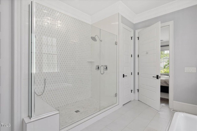 ensuite bathroom with a shower stall and tile patterned floors