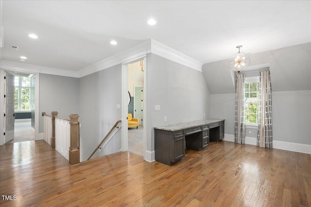 office with baseboards, plenty of natural light, wood finished floors, recessed lighting, and lofted ceiling