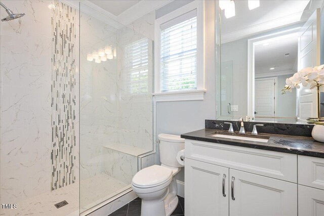 full bath featuring crown molding, toilet, a marble finish shower, and vanity