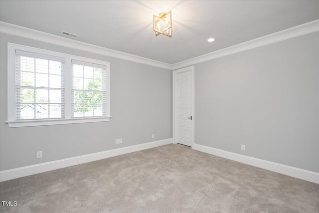 spare room featuring ornamental molding, baseboards, carpet, and recessed lighting