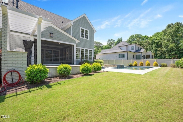 rear view of property featuring a sunroom and brick siding