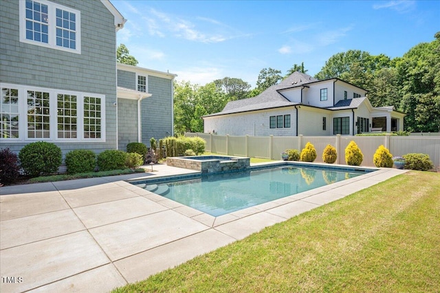 view of pool with a patio and a pool with connected hot tub