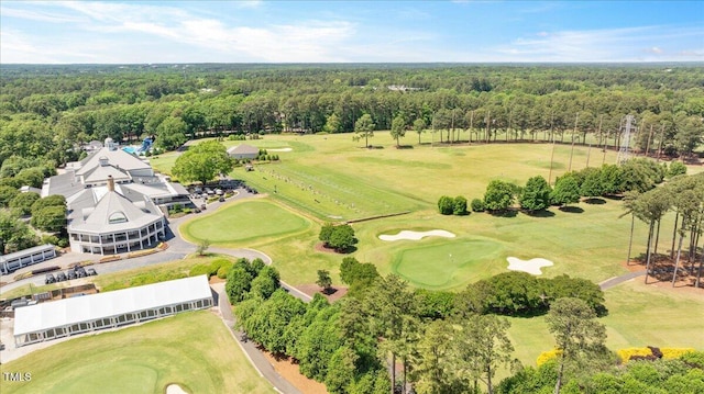 bird's eye view of a heavily wooded area and a local golf course