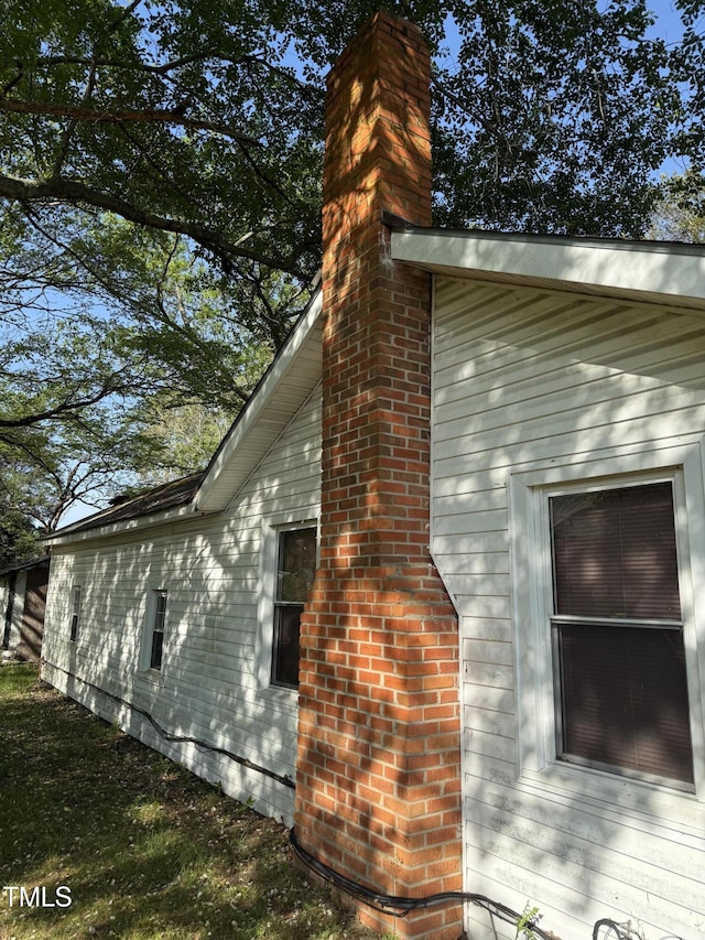 view of home's exterior featuring a chimney