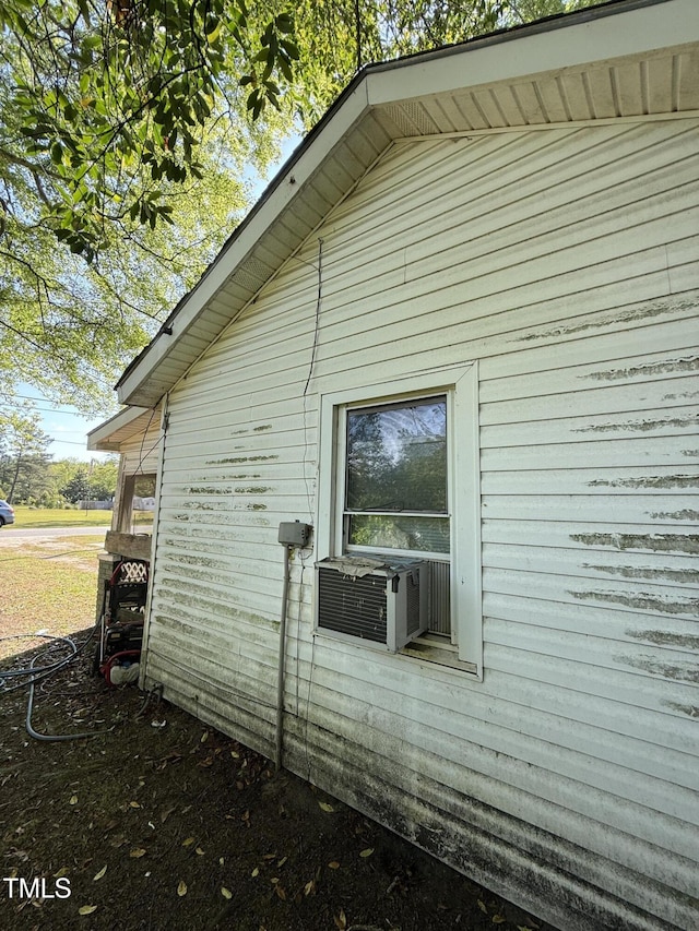 view of side of property with cooling unit