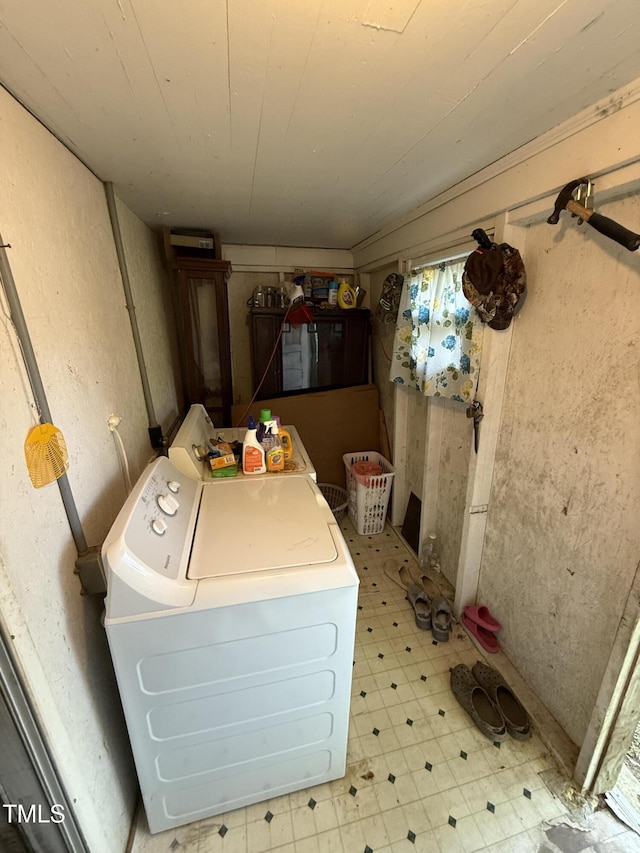laundry room with light floors, laundry area, and washer / clothes dryer