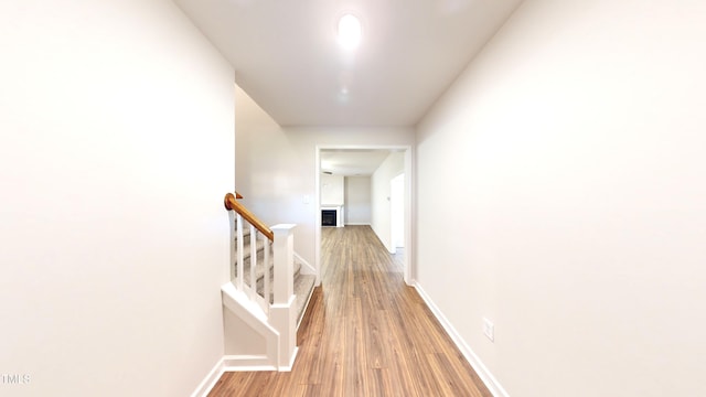 3725 Huntcliff Dr, La Grange, NC 28551 - corridor featuring baseboards, stairs, and wood finished floors