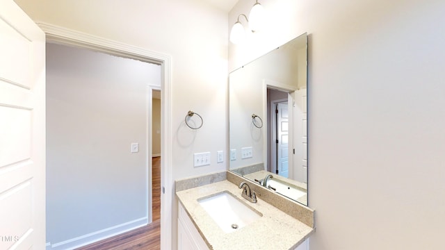 3725 Huntcliff Dr, La Grange, NC 28551 - bathroom featuring baseboards, wood finished floors, and vanity