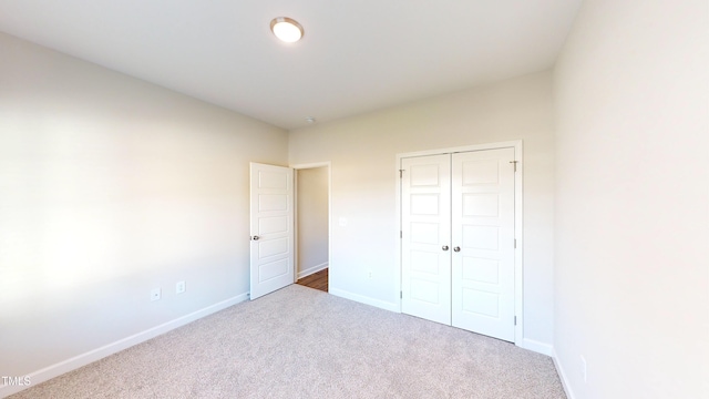 3725 Huntcliff Dr, La Grange, NC 28551 - unfurnished bedroom with baseboards, carpet, and a closet