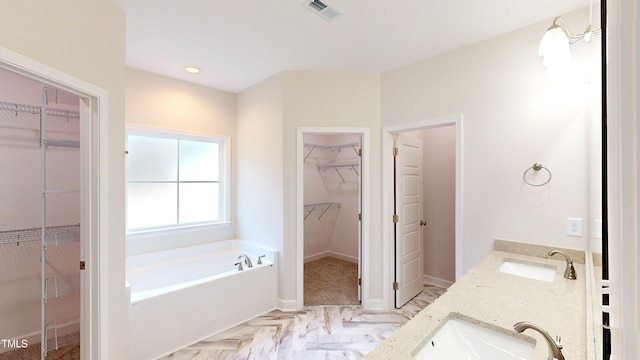 3725 Huntcliff Dr, La Grange, NC 28551 - full bath with visible vents, a sink, a garden tub, and a spacious closet