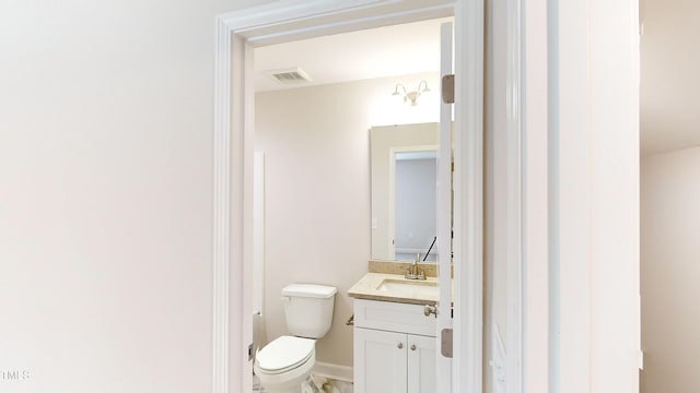 3725 Huntcliff Dr, La Grange, NC 28551 - bathroom featuring visible vents, baseboards, toilet, and vanity