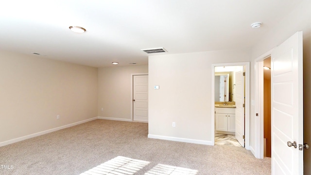 3725 Huntcliff Dr, La Grange, NC 28551 - spare room with baseboards, a sink, visible vents, and light carpet