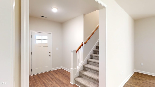 3725 Huntcliff Dr, La Grange, NC 28551 - entryway featuring stairs, baseboards, visible vents, and wood finished floors