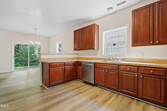 3223 Polite Ln, Raleigh, NC 27610 - kitchen featuring stainless steel dishwasher, a peninsula, a chandelier, a sink, and light wood-style floors
