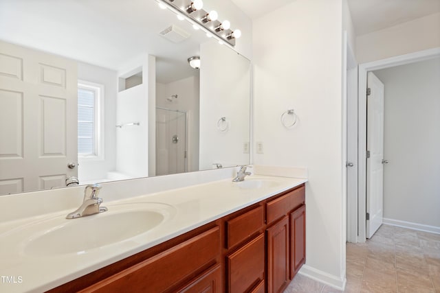 3223 Polite Ln, Raleigh, NC 27610 - full bath with double vanity, a shower, and baseboards