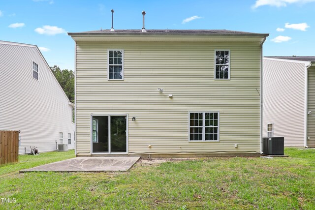 3223 Polite Ln, Raleigh, NC 27610 - back of house with a patio area, a lawn, and central AC
