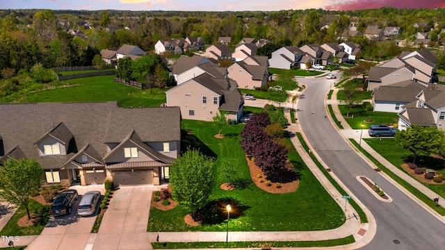 birds eye view of property with a residential view