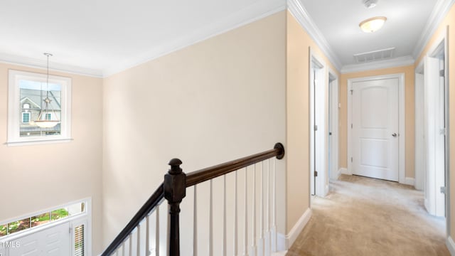 hallway featuring crown molding, light carpet, an upstairs landing, and visible vents