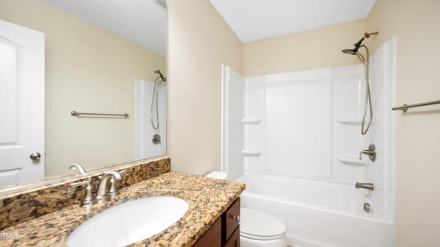 bathroom with vanity, toilet, and shower / bathtub combination