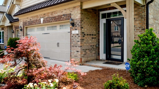 property entrance featuring brick siding