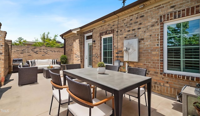 view of patio / terrace featuring outdoor dining space, area for grilling, outdoor lounge area, and fence