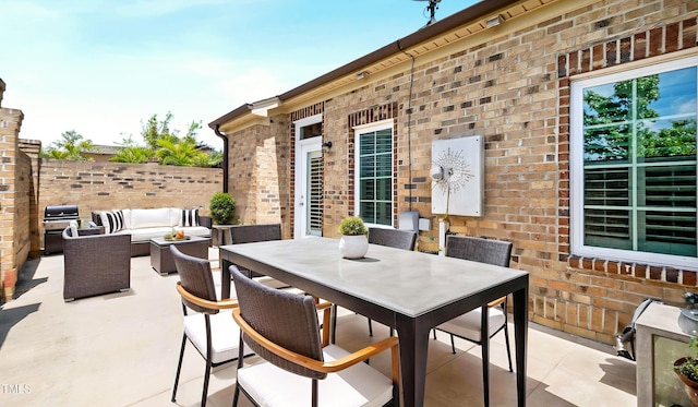 view of patio featuring an outdoor hangout area, area for grilling, outdoor dining area, and fence