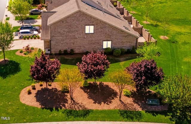 view of home's exterior with brick siding