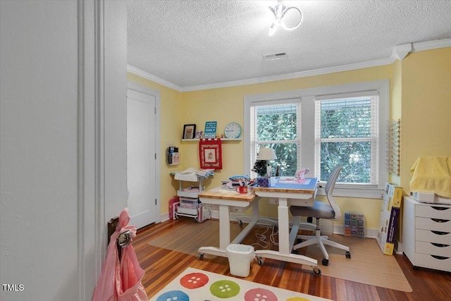 office featuring baseboards, a textured ceiling, ornamental molding, and wood finished floors